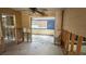 A dining room needing renovation; exposed framing and flooring at 5641 1St Ne St, St Petersburg, FL 33703