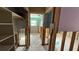 A home hallway during demolition, showing exposed framing and walls at 5641 1St Ne St, St Petersburg, FL 33703