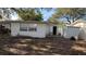 Rear exterior of house showing AC unit and storage at 5641 1St Ne St, St Petersburg, FL 33703