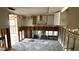 A kitchen undergoing renovation, showing exposed framing and plumbing at 5641 1St Ne St, St Petersburg, FL 33703