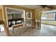 A living room with exposed framing and partial kitchen view at 5641 1St Ne St, St Petersburg, FL 33703