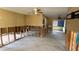 An open living area under renovation; exposed framing and flooring at 5641 1St Ne St, St Petersburg, FL 33703
