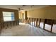 A living room in need of renovation, showing exposed framing and flooring at 5641 1St Ne St, St Petersburg, FL 33703