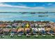 Stunning aerial perspective of a waterfront community with luxurious homes, set against a breathtaking backdrop of ocean views at 6015 Kipps Colony E Dr, Gulfport, FL 33707