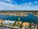 An aerial view of a waterfront home in a desirable location surrounded by tranquil blue waters and picturesque views at 6015 Kipps Colony E Dr, Gulfport, FL 33707