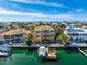Aerial view of waterfront home with pool, dock, and gulf access at 6015 Kipps Colony E Dr, Gulfport, FL 33707