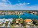 Overhead view of a beautiful house situated on the water, enjoying scenic surroundings and a vibrant neighborhood atmosphere at 6015 Kipps Colony E Dr, Gulfport, FL 33707