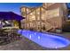 Backyard with an inviting pool and outdoor seating under a covered patio at 6015 Kipps Colony E Dr, Gulfport, FL 33707
