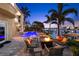 A luxurious backyard featuring a pool, fire pit, and waterfront access for ultimate relaxation and entertainment at 6015 Kipps Colony E Dr, Gulfport, FL 33707