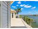 Spacious tiled balcony with stunning water views and a bright, sunny sky at 6015 Kipps Colony E Dr, Gulfport, FL 33707