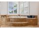 Bathroom with a corner garden tub, tile surround, and shuttered windows at 6015 Kipps Colony E Dr, Gulfport, FL 33707