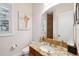 Elegant powder room featuring a granite countertop, decorative art and fixtures, and a modern design at 6015 Kipps Colony E Dr, Gulfport, FL 33707