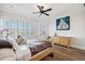 Bedroom with bright windows, and neutral colors and hardwood floors at 6015 Kipps Colony E Dr, Gulfport, FL 33707