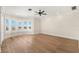 Spacious bedroom featuring hardwood floors, neutral walls, and natural light from many windows at 6015 Kipps Colony E Dr, Gulfport, FL 33707