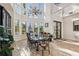 Elegant dining room featuring stained glass windows, high ceilings and an abundance of natural light at 6015 Kipps Colony E Dr, Gulfport, FL 33707