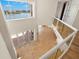 Bright foyer boasts high ceilings, tile floors, and a view of the waterfront through large windows at 6015 Kipps Colony E Dr, Gulfport, FL 33707