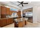 Chef's kitchen with custom cabinets, stainless appliances, an island, and tile flooring at 6015 Kipps Colony E Dr, Gulfport, FL 33707