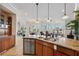Gourmet kitchen with granite counters, stainless appliances, open to dining and living areas at 6015 Kipps Colony E Dr, Gulfport, FL 33707