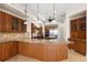 Spacious kitchen featuring granite counters, custom wood cabinetry, and stainless steel appliances at 6015 Kipps Colony E Dr, Gulfport, FL 33707