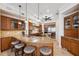 Spacious kitchen featuring custom wood cabinetry, granite countertops, and stainless steel appliances at 6015 Kipps Colony E Dr, Gulfport, FL 33707