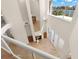 View from above of the living room with a fireplace and floor-to-ceiling windows boasting water views at 6015 Kipps Colony E Dr, Gulfport, FL 33707