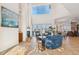 Spacious living room with a fireplace, high ceilings, and views of the water at 6015 Kipps Colony E Dr, Gulfport, FL 33707