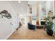 Open-concept living area features tile flooring, high ceilings, and elegant decor at 6015 Kipps Colony E Dr, Gulfport, FL 33707