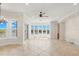 Waterfront living room with floor to ceiling windows, offering views and seamless access to outdoor spaces at 6015 Kipps Colony E Dr, Gulfport, FL 33707