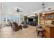 Open-concept living area with seating area and wet bar offering beautiful water views at 6015 Kipps Colony E Dr, Gulfport, FL 33707