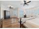 Spacious main bedroom with water views, hardwood floors, shutters, and tray ceilings at 6015 Kipps Colony E Dr, Gulfport, FL 33707