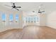 Expansive main bedroom featuring hardwood floors and a bay window with water views at 6015 Kipps Colony E Dr, Gulfport, FL 33707
