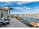 Balcony with beautiful water views, outdoor seating, and dock at 6015 Kipps Colony E Dr, Gulfport, FL 33707