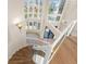 An elevated view of the entryway shows the staircase, chandelier, and stained-glass windows, with the front door at 6015 Kipps Colony E Dr, Gulfport, FL 33707