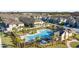 Community pool, clubhouse, and numerous houses with lush landscaping at 8280 Rolling Tides Dr, New Port Richey, FL 34655