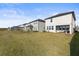 Expansive backyard showcasing multiple homes with lush lawns at 8280 Rolling Tides Dr, New Port Richey, FL 34655