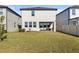 Large backyard with grassy lawn and spacious patio at 8280 Rolling Tides Dr, New Port Richey, FL 34655