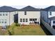Spacious backyard with a badminton net at 8280 Rolling Tides Dr, New Port Richey, FL 34655