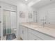 Modern bathroom with double vanity and a shower/tub combo at 8280 Rolling Tides Dr, New Port Richey, FL 34655