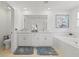 Elegant bathroom with double vanity, soaking tub, and separate shower at 8280 Rolling Tides Dr, New Port Richey, FL 34655