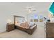 Spacious primary bedroom with plush bed and ample natural light at 8280 Rolling Tides Dr, New Port Richey, FL 34655