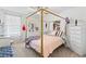 Elegant bedroom with a gold canopy bed and dresser at 8280 Rolling Tides Dr, New Port Richey, FL 34655