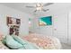 Serene bedroom with a TV and ceiling fan at 8280 Rolling Tides Dr, New Port Richey, FL 34655