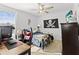 Cozy bedroom with a desk and a ceiling fan at 8280 Rolling Tides Dr, New Port Richey, FL 34655