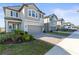 Houses with gray siding and gray garage doors in a row at 8280 Rolling Tides Dr, New Port Richey, FL 34655