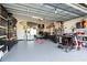 Organized garage with shelving, fitness equipment, and storage at 8280 Rolling Tides Dr, New Port Richey, FL 34655