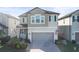 Two-story house with gray siding and a gray garage door at 8280 Rolling Tides Dr, New Port Richey, FL 34655