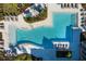 Relaxing community pool with plenty of lounge chairs at 8280 Rolling Tides Dr, New Port Richey, FL 34655