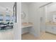 Small powder room with a white vanity and a toilet at 8280 Rolling Tides Dr, New Port Richey, FL 34655