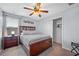 Comfortable bedroom with a wood frame bed, neutral walls, and a closet at 8315 Round Leaf Ln, Riverview, FL 33578