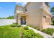 Covered front porch with gray door and welcoming decor at 8315 Round Leaf Ln, Riverview, FL 33578